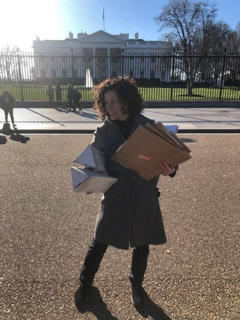 Dana Ellyn packing a painting for shipping