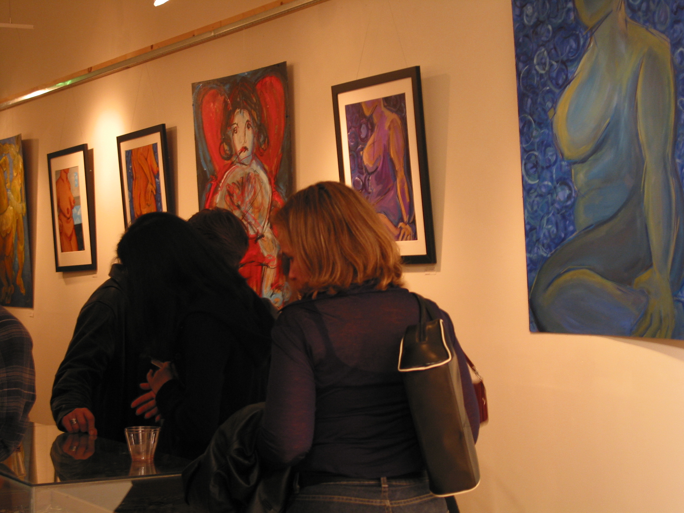 Gallery visitors viewing the Nudes paintings on display at NZen Gallery, 2002