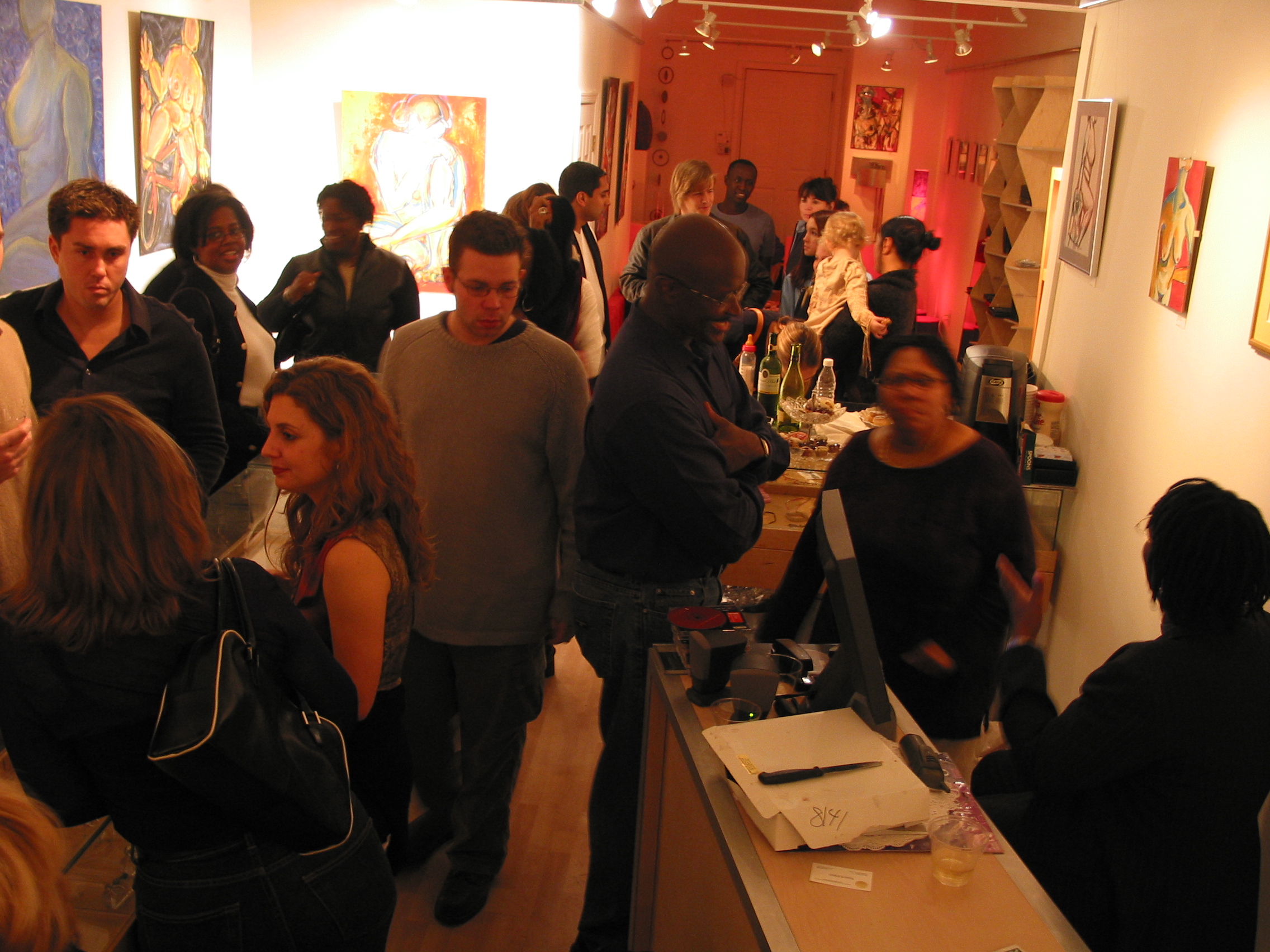 Guests at the Nudes opening reception near the refreshments table, NZen Gallery, 2002