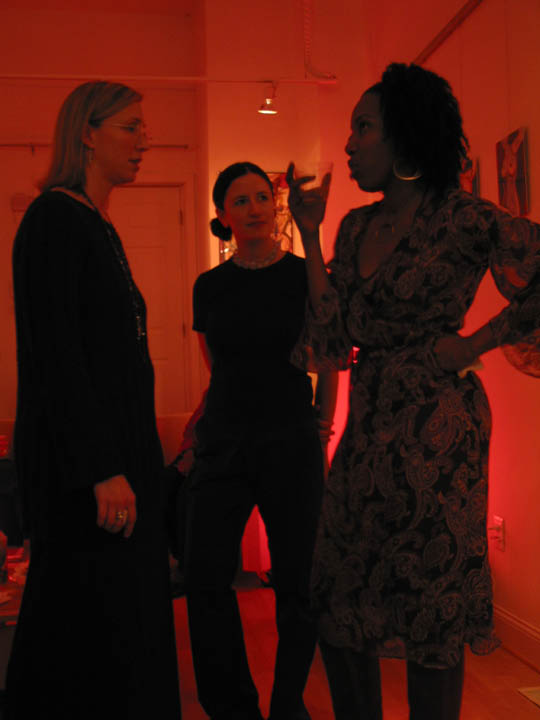 Guests conversing in the red-lit gallery space at the Nudes opening reception, NZen Gallery, 2002