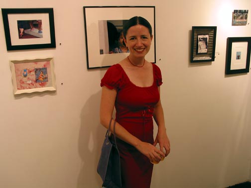 Dana Ellyn at the To the Nth Degree opening reception, Touchstone Gallery, 2002, standing near the framed works on paper