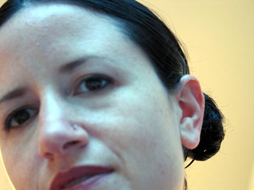 Close-up portrait of Dana Ellyn at the To the Nth Degree opening reception, Touchstone Gallery, 2002