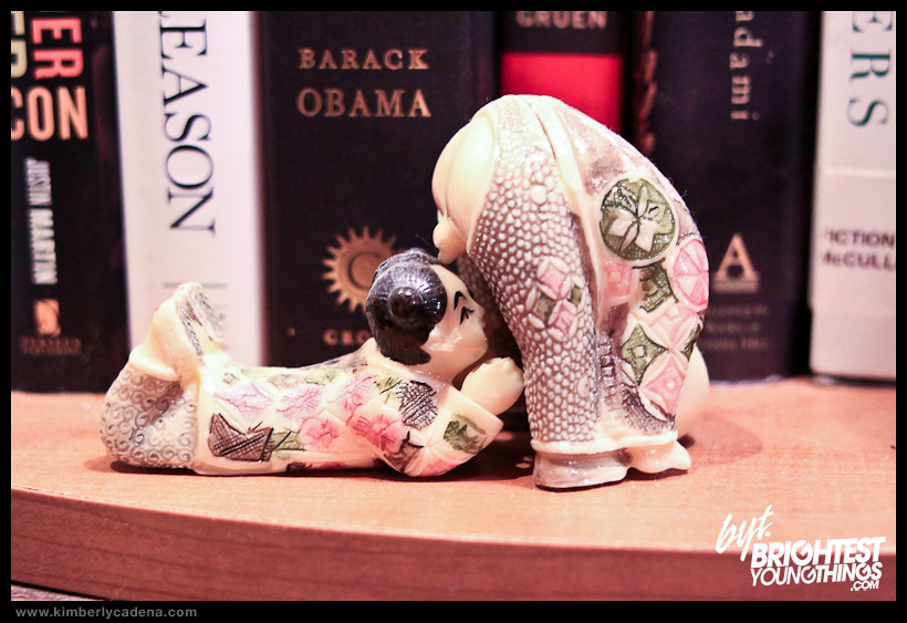 A figurine on a bookshelf