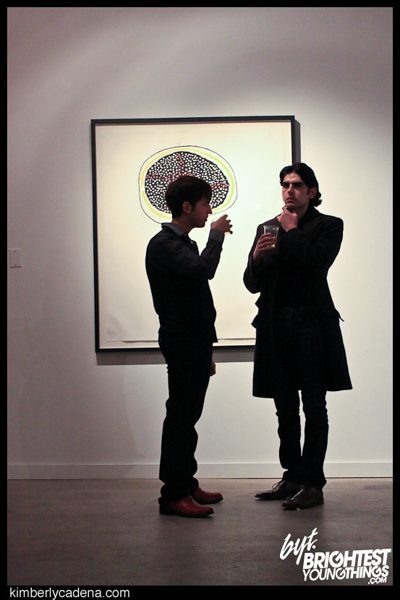 Guests in front of a painting