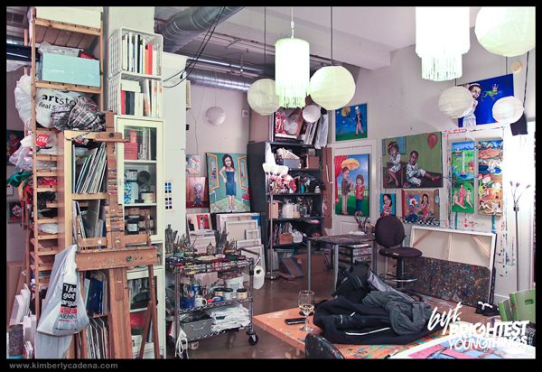 The studio, with paintings on the walls