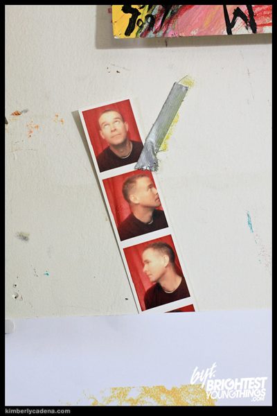 A photo-booth strip on the wall