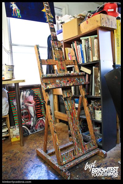 A paint-covered easel