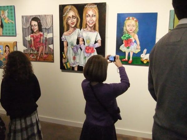 Dana Ellyn and Matt Sesow's wedding at Long View Gallery, 2010: Guests with Dana's paintings