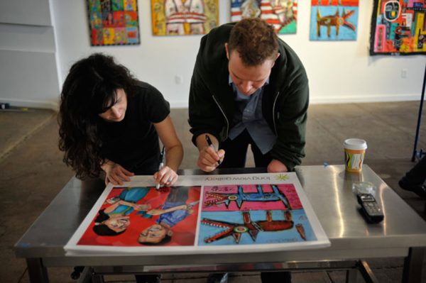 Dana Ellyn and Matt Sesow's wedding at Long View Gallery, 2010: Putting up show posters the day before the wedding, February 4, 2010 &middot; Photo: Matt Dunn / Washington City Paper