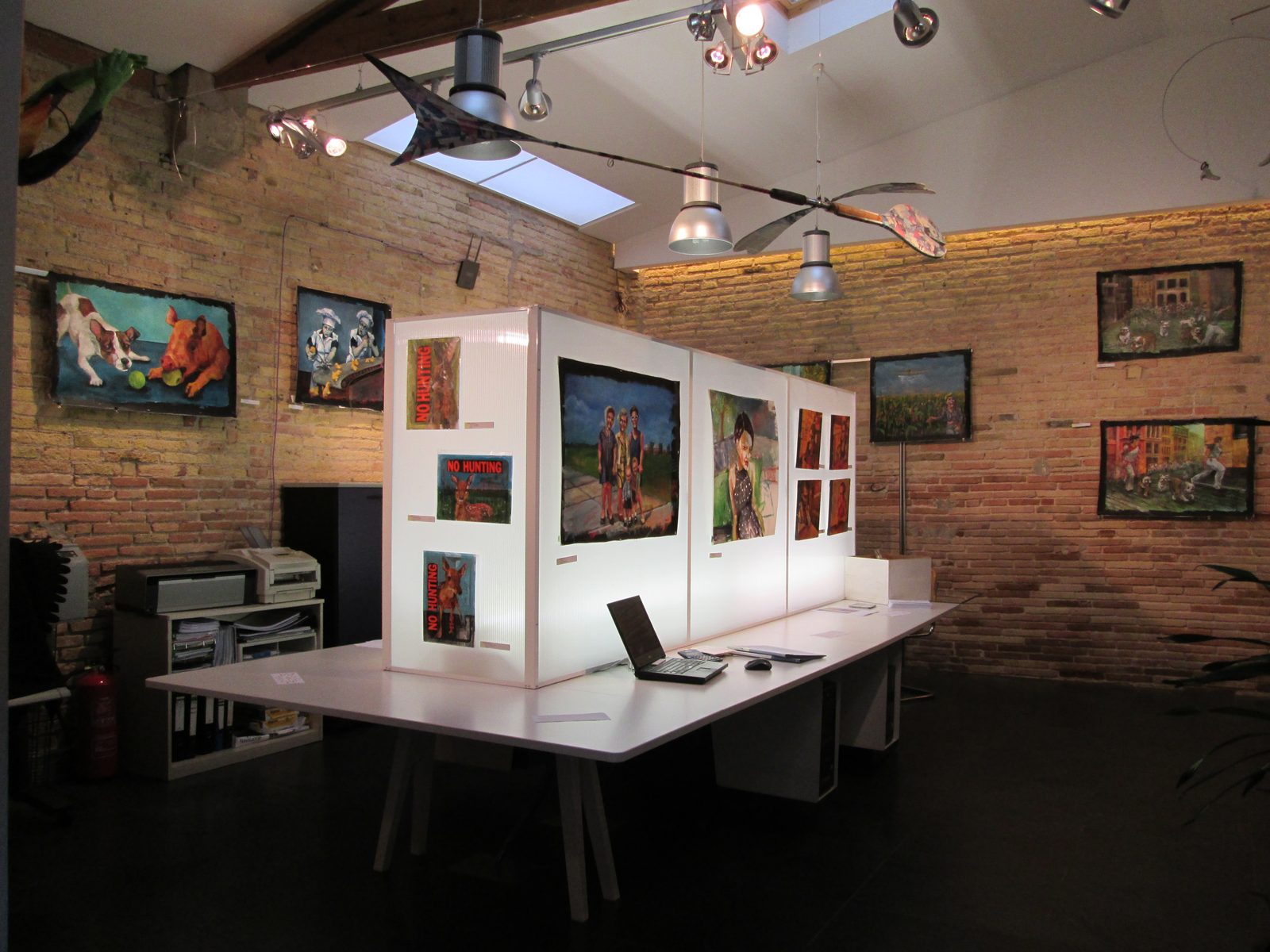 Dana Ellyn's paintings on the brick walls and white display panels inside Flash Gallery, Barcelona, 2014
