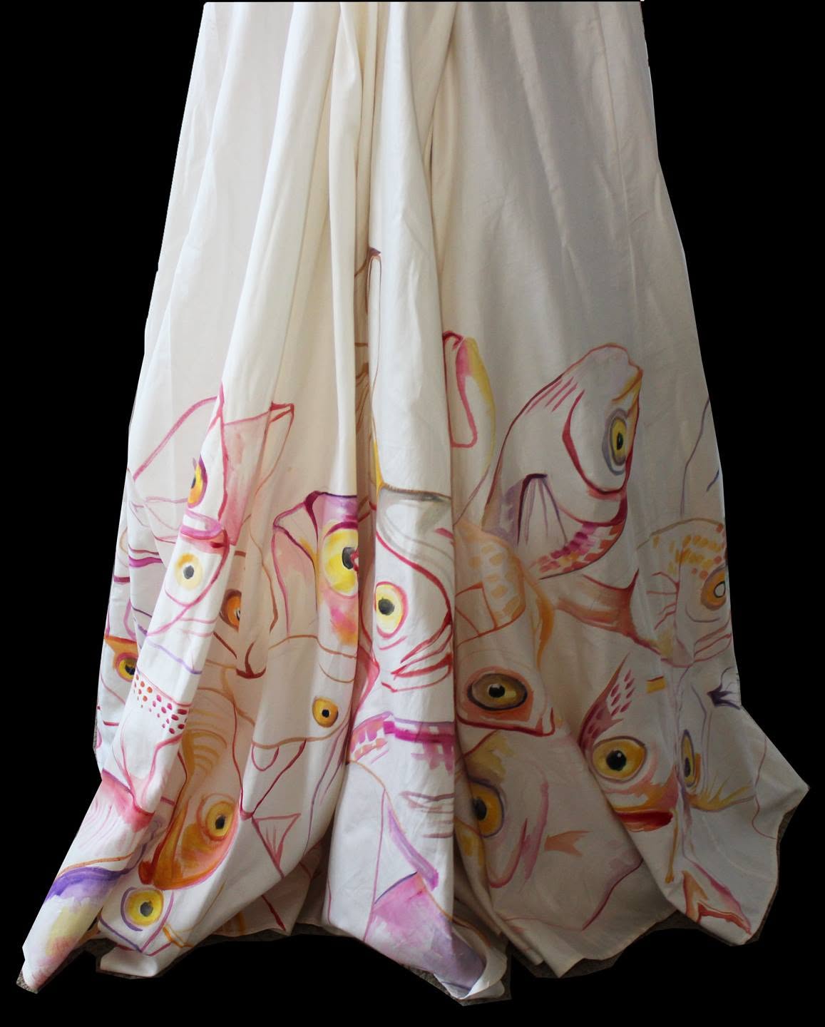 Hand-painted Bycatch, By Hand skirt hanging in folds, its hem covered in painted fish with yellow eyes