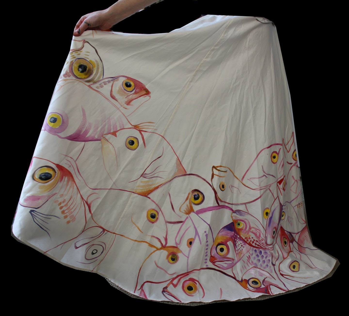 Hand-painted skirt from a Bycatch, By Hand dress, held open to show pink, red and yellow-eyed fish